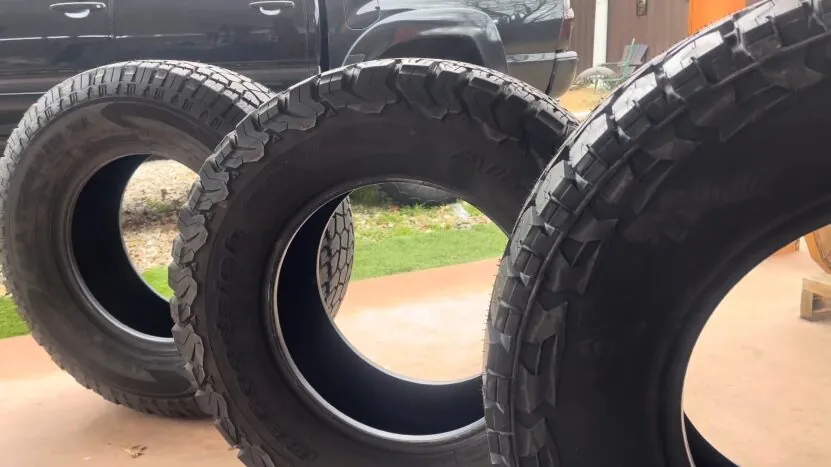 Three Off-Road Tires Lined up Side by Side, Showcasing Their Tread Patterns and Size