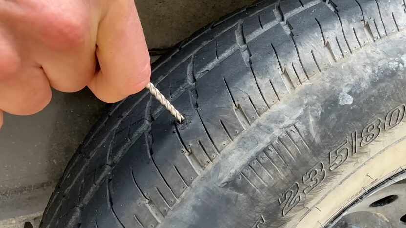 Inserting a Plug Into a Punctured Tire, a Common Method for Fixing Small Tread Punctures