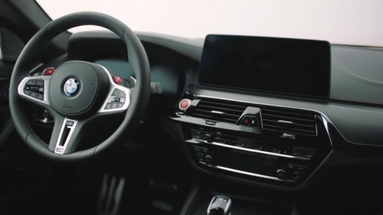 Interior View of A BMW Featuring the Steering Wheel and Dashboard, Highlighting Potential Areas for Tuning File Adjustments