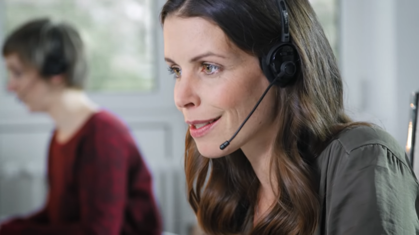 BMW Customer Support Representative Wearing a Headset While Assisting a Client