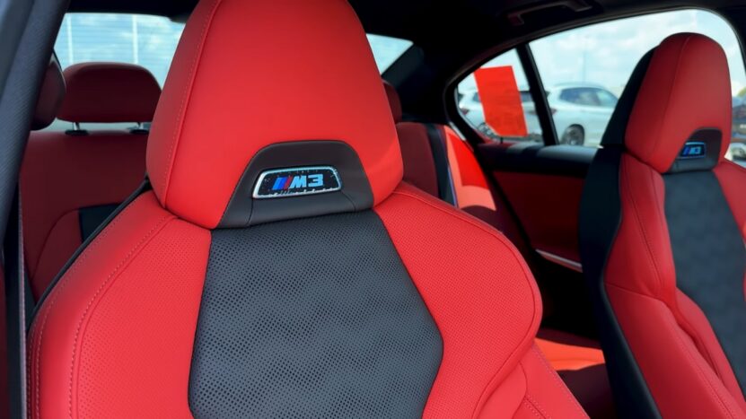 Close-Up of The Red and Black Leather Sports Seats in The 2025 BMW M3, Featuring the M3 Logo on The Headrest