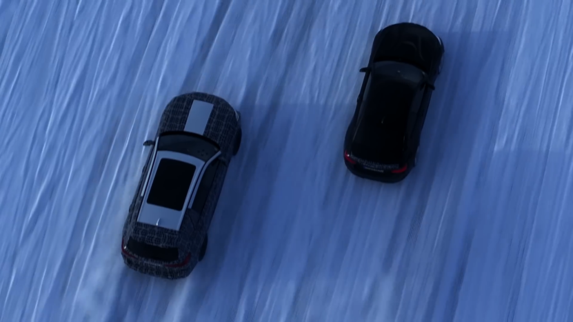 Two High-Performance BMWs Driving on A Snowy Road, Demonstrating Their Ability to Handle Adverse Weather Conditions