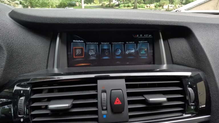 The Image Shows a BMW Infotainment Screen Displaying Various Options Like Media/radio, Communication, Navigation, Connected Drive, and More, Ready for Apple CarPlay Integration