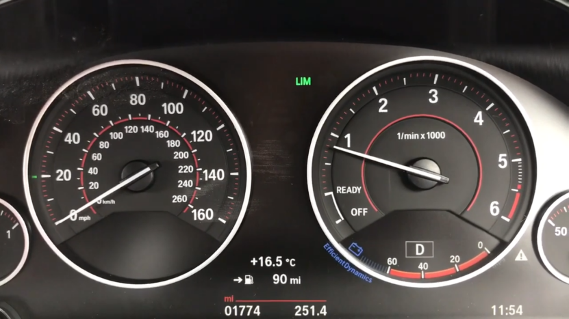 BMW Dashboard Showing the Speedometer and Tachometer with An Active Speed Limiter Indicator