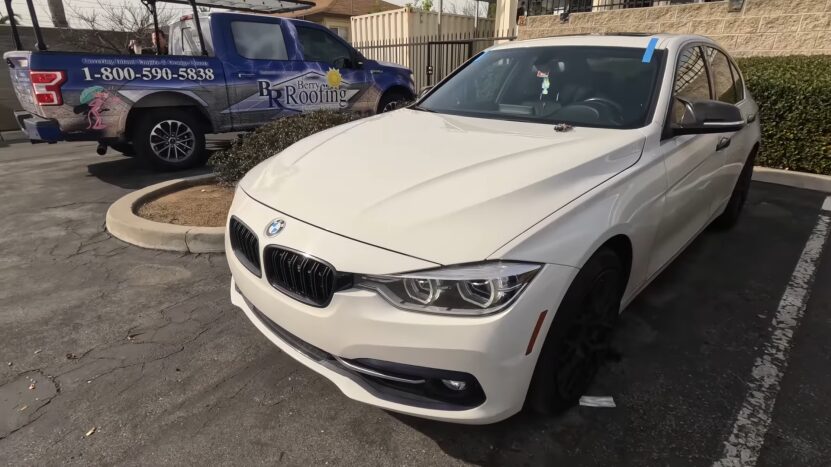 A White BMW Parked with A Newly Installed Windshield