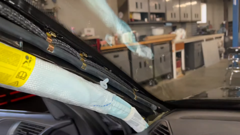 A Close-Up View of A Partially Installed BMW Windshield