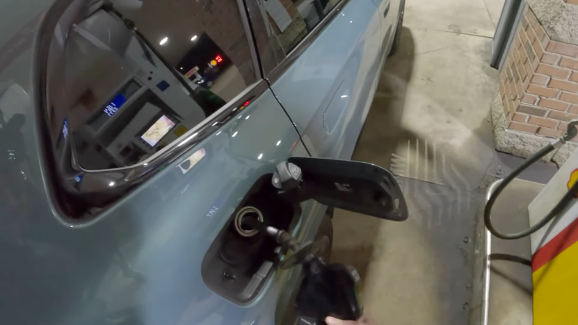 Close-Up of A BMW Being Refueled at A Gas Station