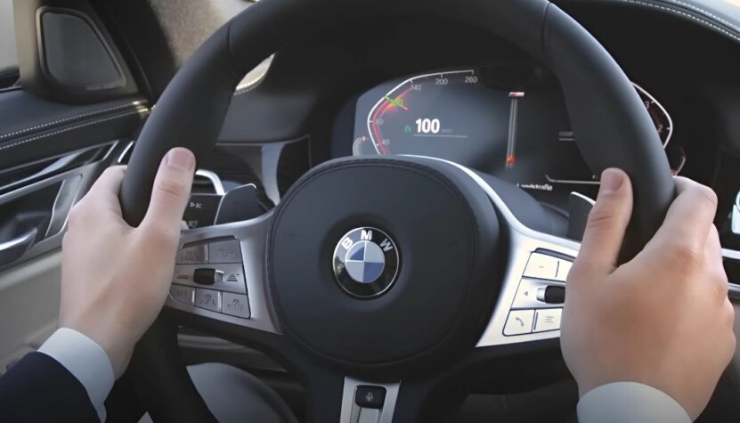 Man holding BMW's steering wheel