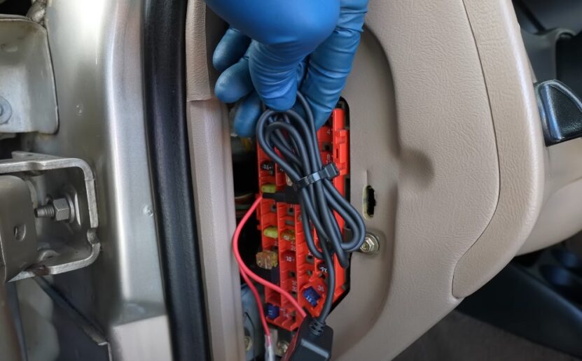 Putting wires back to place after connecting dashcam