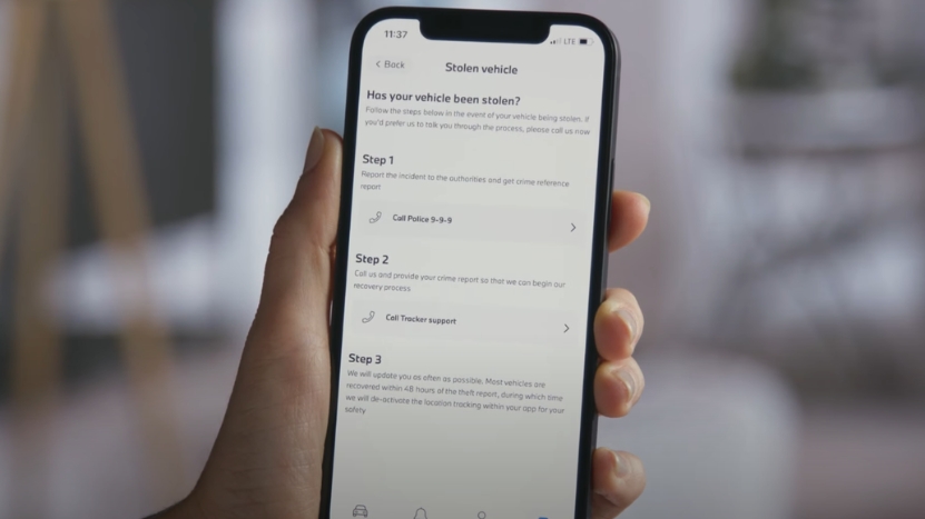 Hand Holding a Phone Showing Steps to Report a Stolen BMW