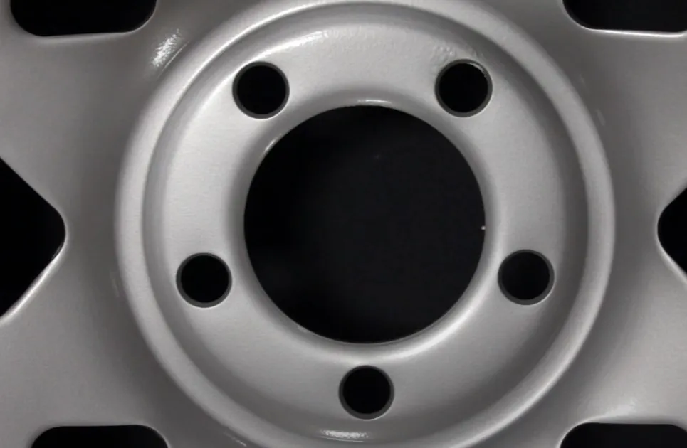 Silver wheel rim with five bolt holes