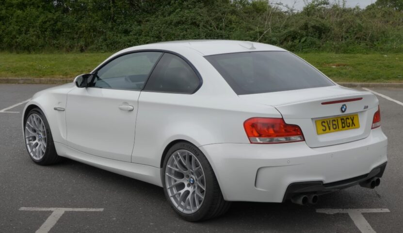 White BMW 1 Series coupe on a parking lot